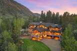 Experience luxury mountain living in this stunning log home, nestled amidst a breathtaking natural landscape.