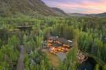 Nestled amidst a lush forest and rolling mountains, this stunning mountain lodge offers unparalleled luxury and privacy.