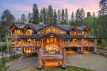 Experience luxury mountain living in this stunning log home, nestled amidst towering pine trees.