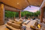 Experience luxurious outdoor living with this stunning covered patio, featuring a spacious seating area perfect for entertaining.