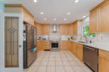 Step into this beautifully updated kitchen featuring sleek stainless steel appliances, including a refrigerator, range, and dishwasher.