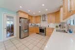 Discover this beautifully updated kitchen featuring sleek stainless steel appliances, including a French door refrigerator and a modern range.