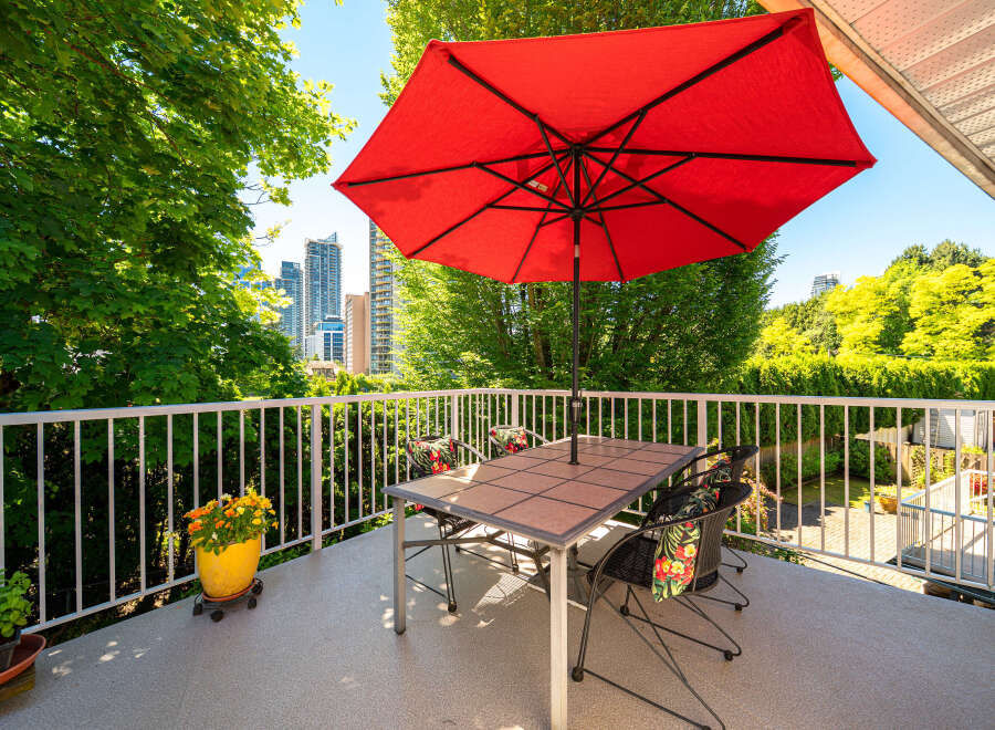 Enjoy outdoor living on this spacious balcony, perfect for al fresco dining or relaxing with a view.