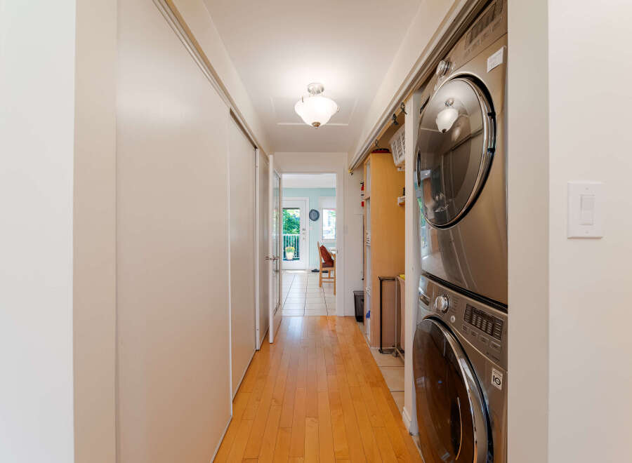 This hallway features a stacked LG washer and dryer unit, perfect for maximizing space in your laundry area.