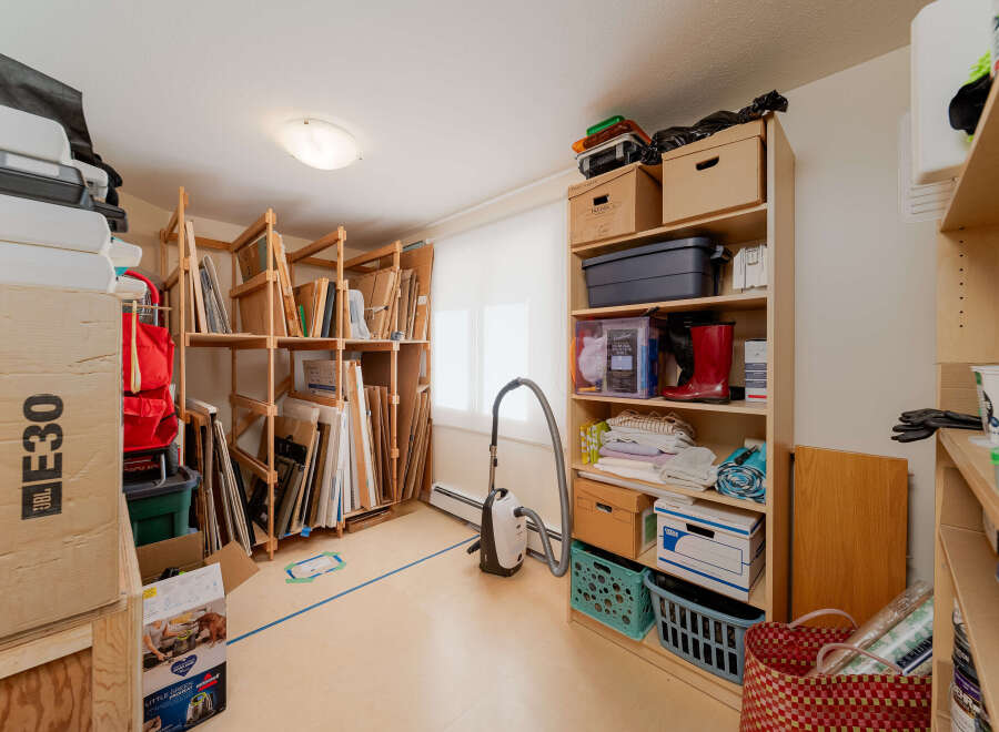 Discover ample storage solutions in this versatile space, perfect for organizing art supplies, seasonal decorations, or general household items.