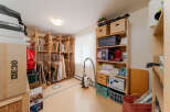 Discover ample storage solutions in this versatile space, perfect for organizing art supplies, seasonal decorations, or general household items.