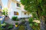 Discover this charming property featuring a well-maintained exterior with white siding and a welcoming entryway.