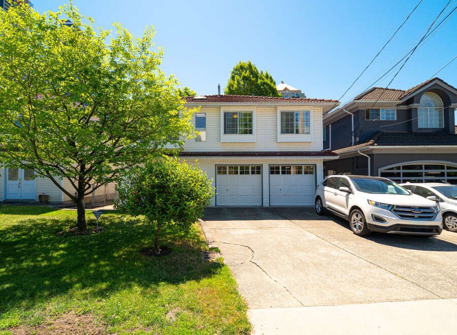 Discover this charming home featuring a spacious driveway leading to a double garage, perfect for multiple vehicles.