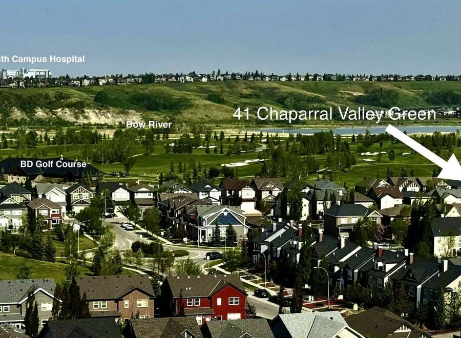 Discover luxurious living at 41 Chaparral Valley Green, offering stunning views of the Bow River and the prestigious BD Golf Course.