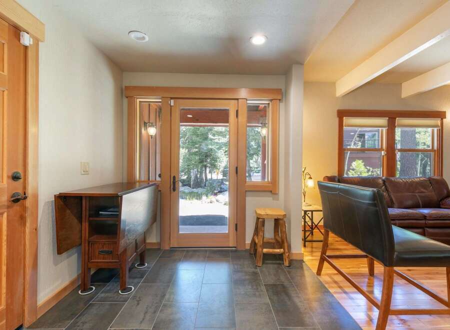 Step into this inviting entryway featuring a convenient drop-leaf table perfect for quick meals or extra workspace.