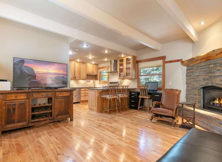 Experience the perfect blend of rustic charm and modern convenience in this open-concept living space.