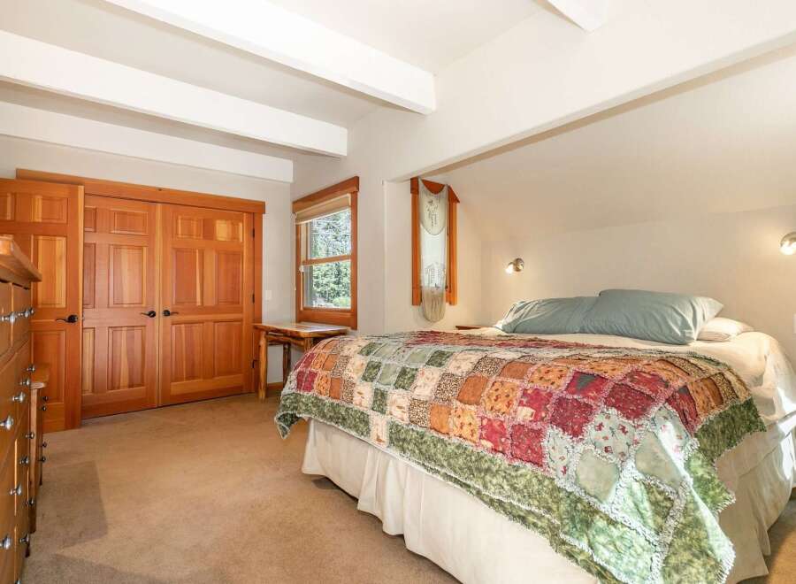 Discover this charming bedroom featuring a cozy, rustic aesthetic.