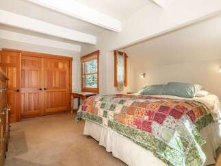 Discover this charming bedroom featuring a cozy, rustic aesthetic.