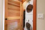 Discover the convenience of a stacked washer and dryer unit, perfect for maximizing space in this home.