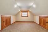 Discover this charming attic space, perfect for a home office or extra storage.