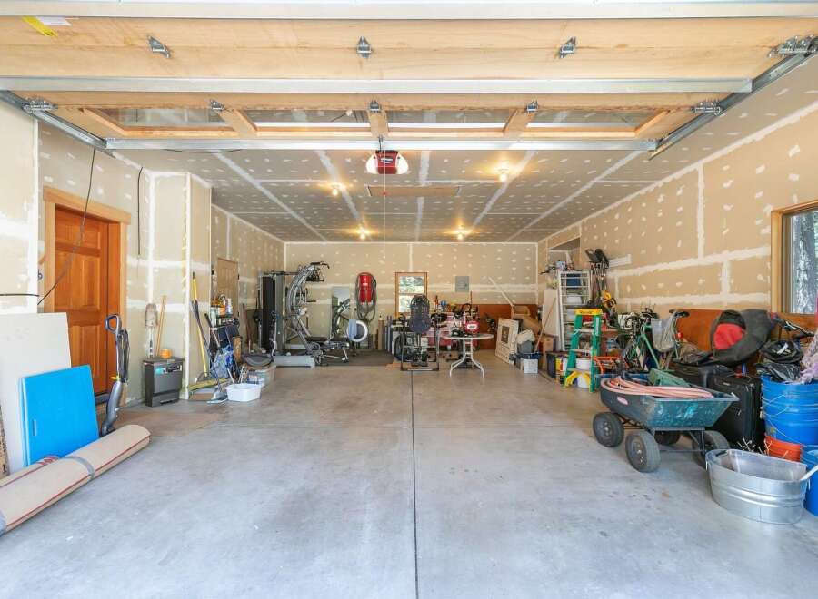 This spacious garage offers ample storage and workspace, perfect for any homeowner's needs.