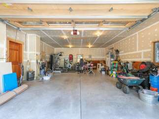 This spacious garage offers ample storage and workspace, perfect for any homeowner's needs.