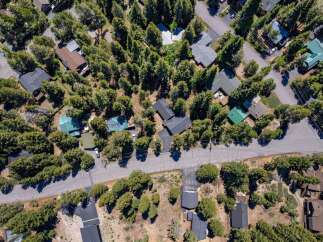 Discover this charming mountain retreat nestled amongst towering trees, offering a serene and private escape.