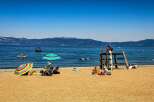 Enjoy a perfect summer day at this stunning lakeside property, featuring a sandy beach and crystal-clear waters ideal for swimming and water sports.