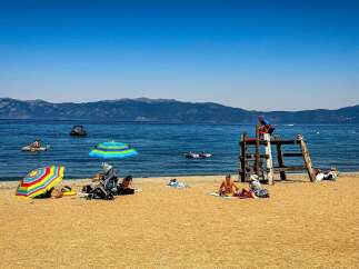 Enjoy a perfect summer day at this stunning lakeside property, featuring a sandy beach and crystal-clear waters ideal for swimming and water sports.