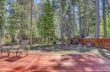 Enjoy the serene mountain lifestyle with this charming property featuring a spacious wooden deck perfect for outdoor entertaining.