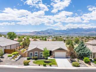 Discover this stunning single-story home offering breathtaking mountain views and a serene desert landscape.