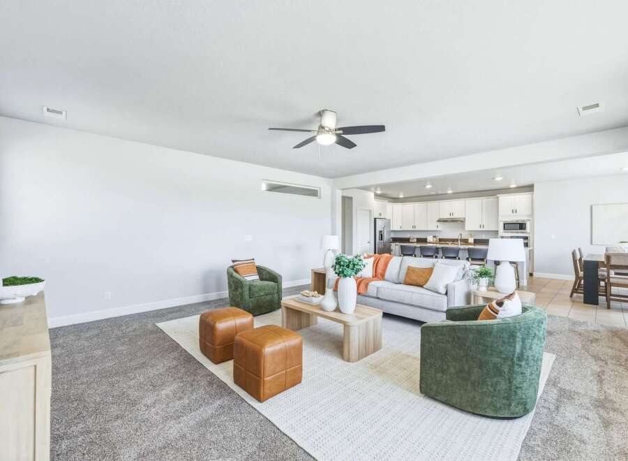 Experience modern living in this spacious open-concept home, featuring a bright living area perfect for gatherings and a sleek, contemporary kitchen with ample counter space.