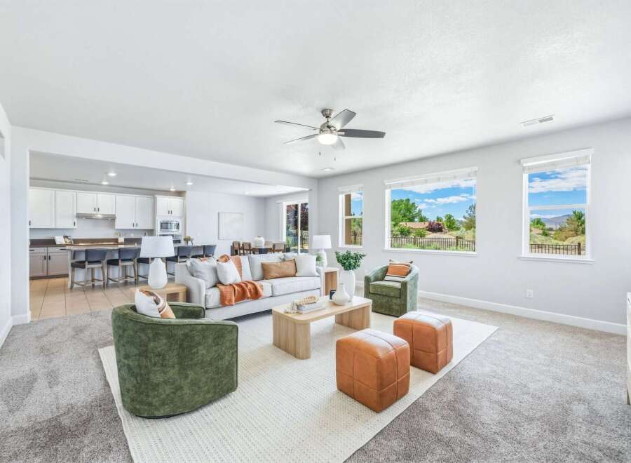 Experience modern living in this spacious open-concept home, featuring a gourmet kitchen with a large island perfect for entertaining.