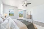Experience breathtaking mountain views from this serene master bedroom, featuring a spacious layout and direct access to an outdoor patio.