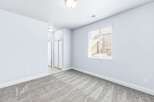Step into this bright and airy room, featuring plush grey carpeting that adds warmth and comfort.