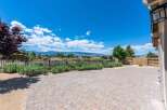 Enjoy breathtaking mountain views from this expansive backyard patio, perfect for entertaining or quiet relaxation.