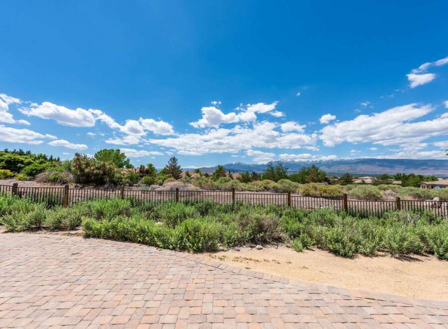 Enjoy breathtaking mountain views from this stunning property, featuring a beautifully paved patio perfect for outdoor entertaining.