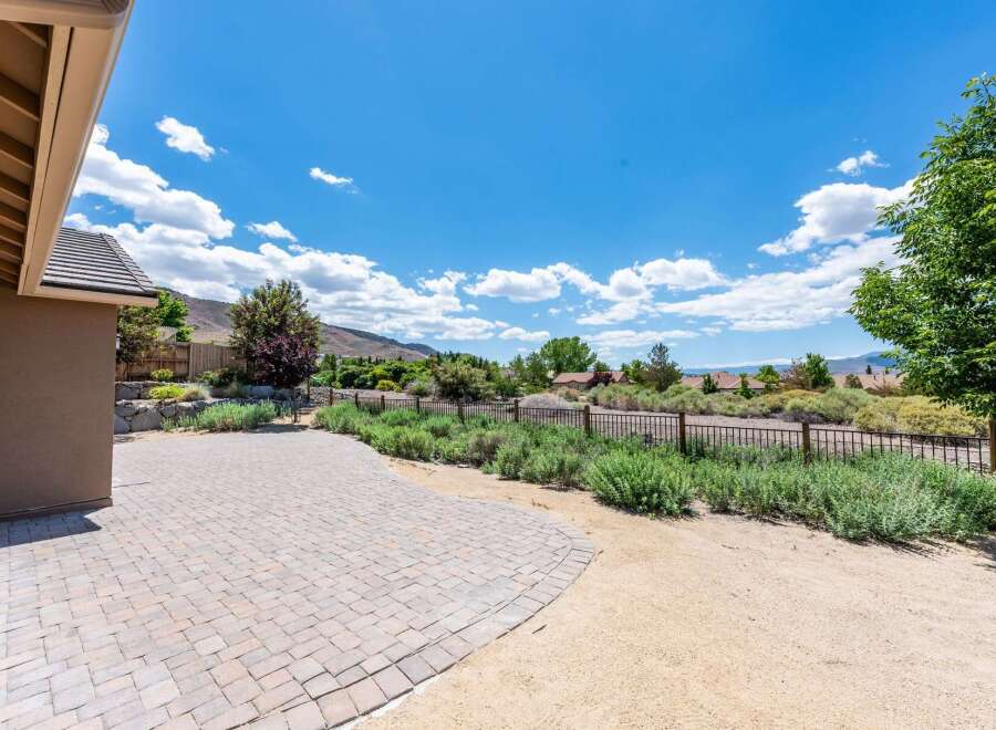Enjoy outdoor living with this expansive paver patio, perfect for entertaining or relaxing.