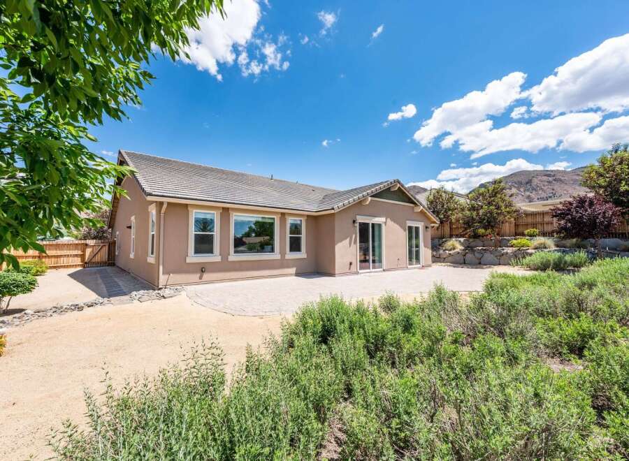 Discover this charming home with a spacious patio, perfect for outdoor entertaining and enjoying the serene mountain views.