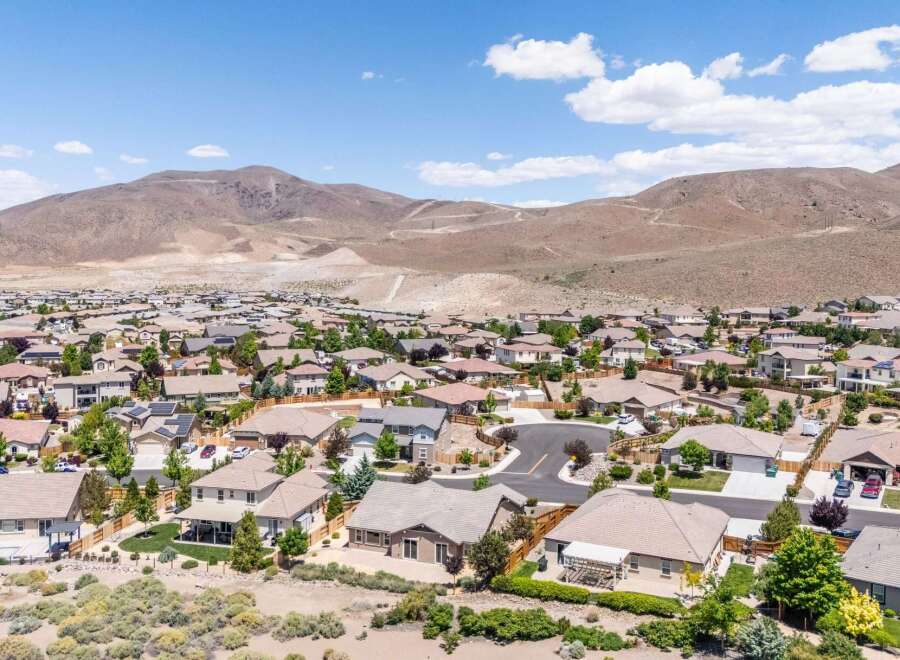 Discover this stunning suburban neighborhood nestled against a backdrop of majestic mountains.