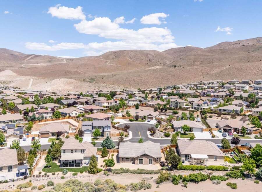 Discover this stunning suburban neighborhood nestled against rolling hills, offering a picturesque backdrop for modern living.