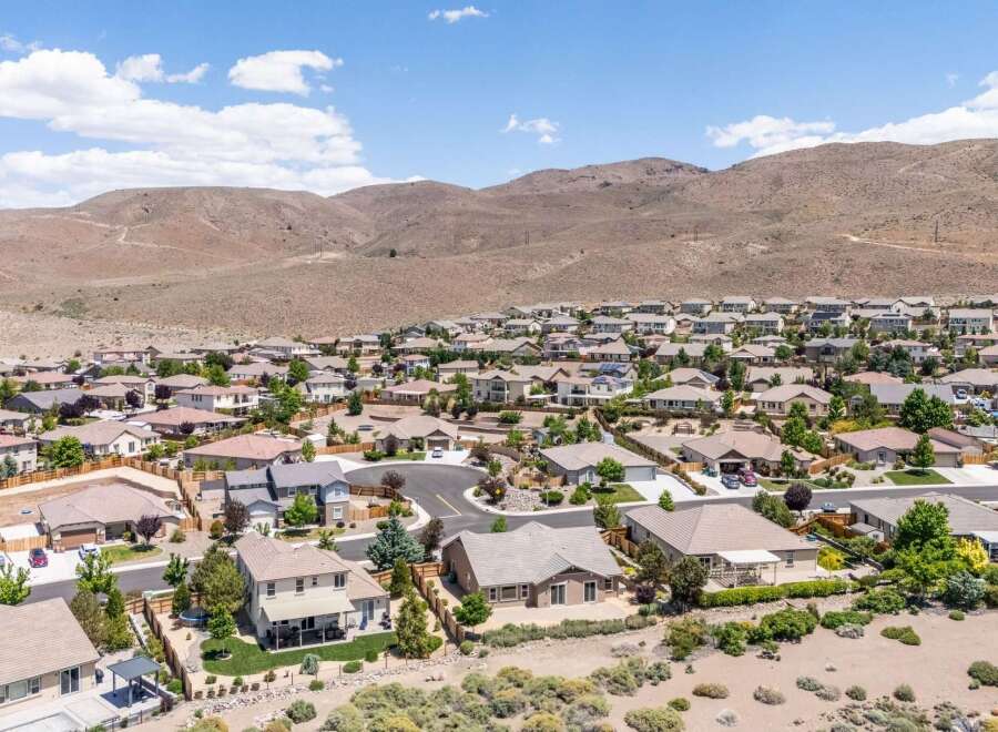Discover this stunning suburban neighborhood nestled against rolling hills, offering a serene escape with beautiful homes and lush landscaping.