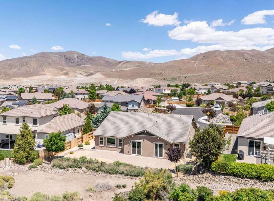Discover this stunning home nestled against a backdrop of majestic mountains, offering breathtaking views and a serene desert landscape.