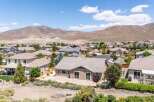 Discover this stunning home nestled against a backdrop of majestic mountains, offering breathtaking views and a serene desert landscape.