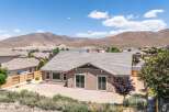 Discover this stunning home featuring a spacious backyard patio perfect for entertaining, complemented by a low-maintenance desert landscape.