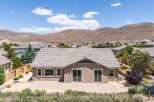 Discover this charming home featuring a spacious backyard patio perfect for outdoor entertaining, complemented by a beautiful desert landscape and stunning mountain views.