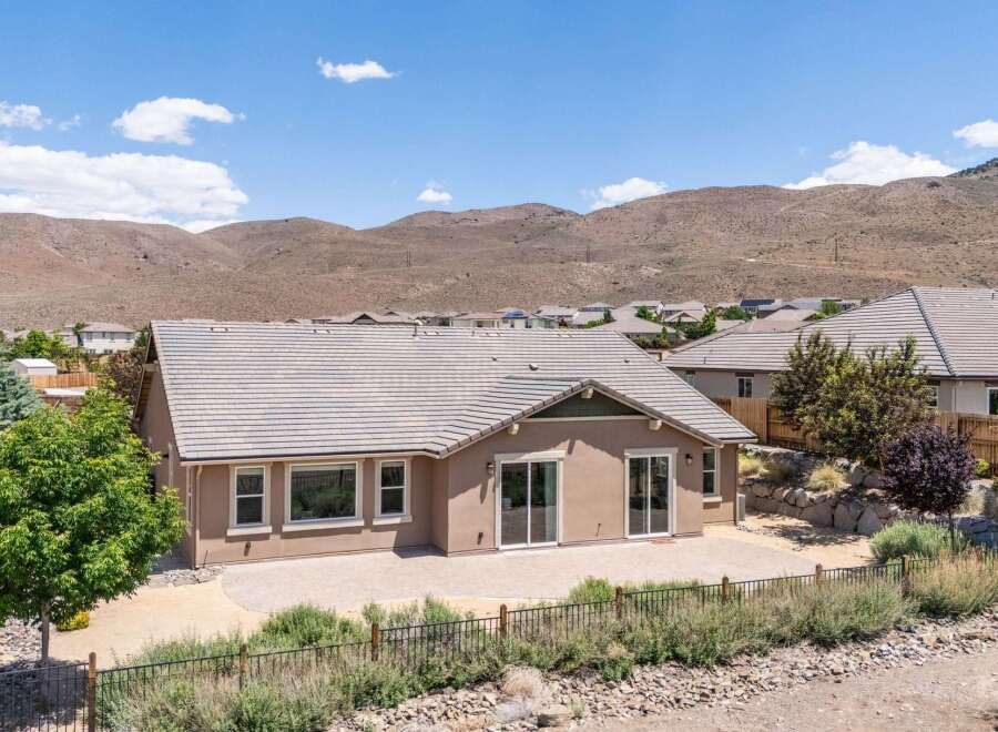 Discover this stunning home featuring a spacious patio perfect for outdoor entertaining, overlooking a serene backyard.