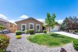 Discover this charming single-story home featuring a well-maintained lawn and attractive landscaping.