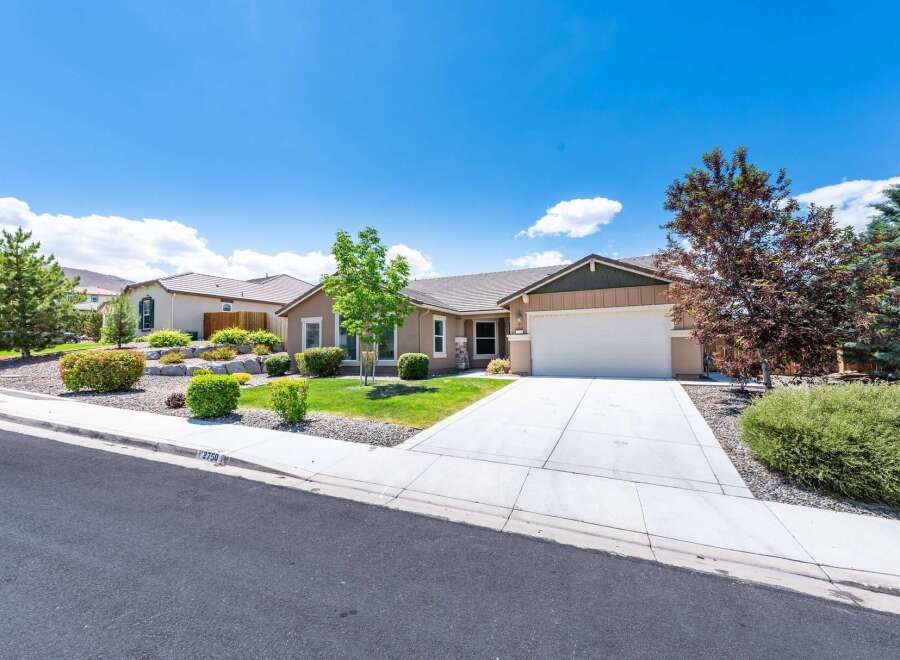 Discover this charming single-story home featuring a beautifully landscaped front yard with mature trees and a well-maintained lawn.