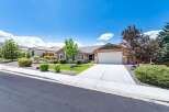 Discover this charming single-story home featuring a beautifully landscaped front yard with mature trees and a well-maintained lawn.