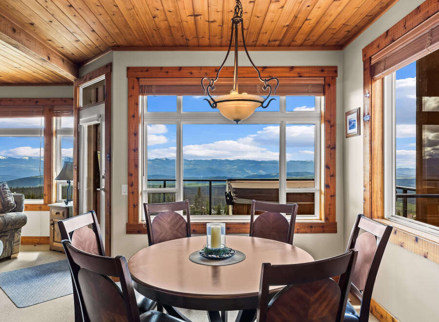 Enjoy breathtaking mountain views from this charming dining area, perfect for intimate meals or entertaining guests.