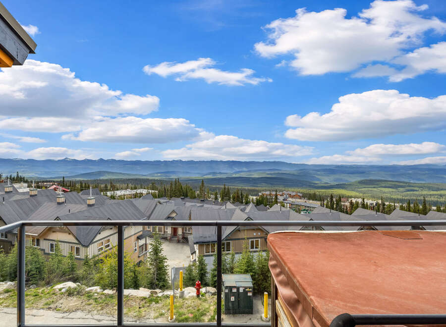 Experience breathtaking mountain views from this stunning property, featuring a private hot tub perfect for relaxation.