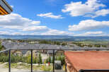 Experience breathtaking mountain views from this stunning property, featuring a private hot tub perfect for relaxation.