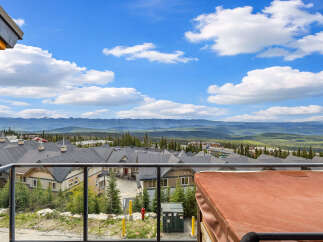 Experience breathtaking mountain views from this stunning property, featuring a private hot tub perfect for relaxation.