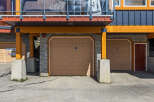 Discover modern living with this stunning property featuring multiple garage doors for ample parking and storage.